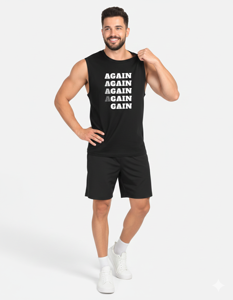 Man wearing a black sleeveless shirt with text and black shorts on a white background