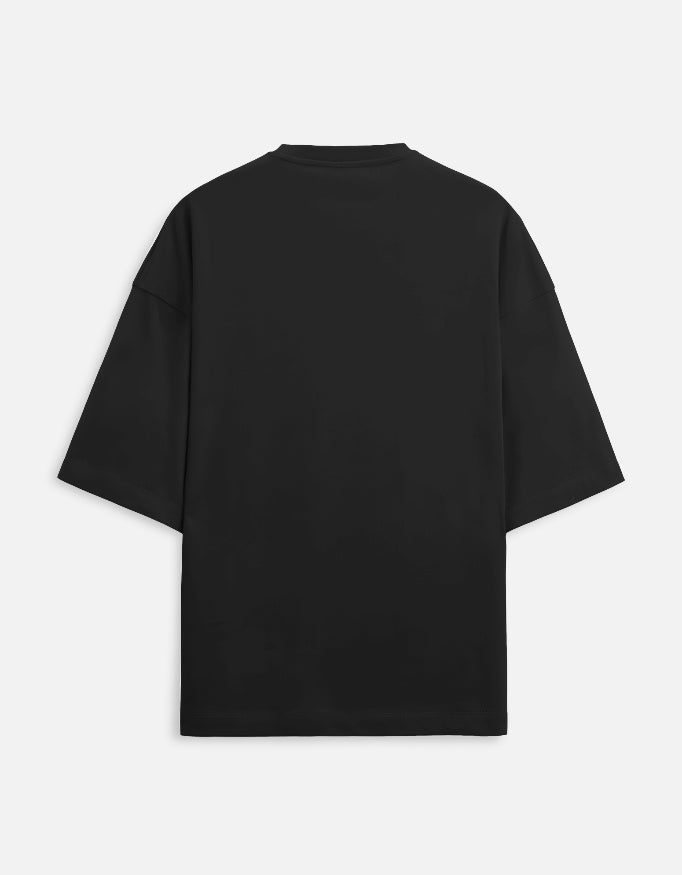 Back view of oversized black short sleeve t-shirt on plain background