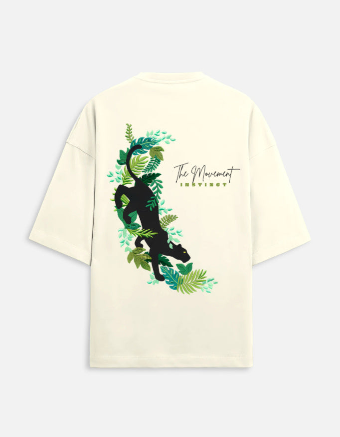 Beige t-shirt with black panther and green jungle leaves graphic, 'The Movement Instinct' text on back
