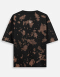 Black short sleeve t-shirt with brown bleach splatter pattern and small fox logo on the back