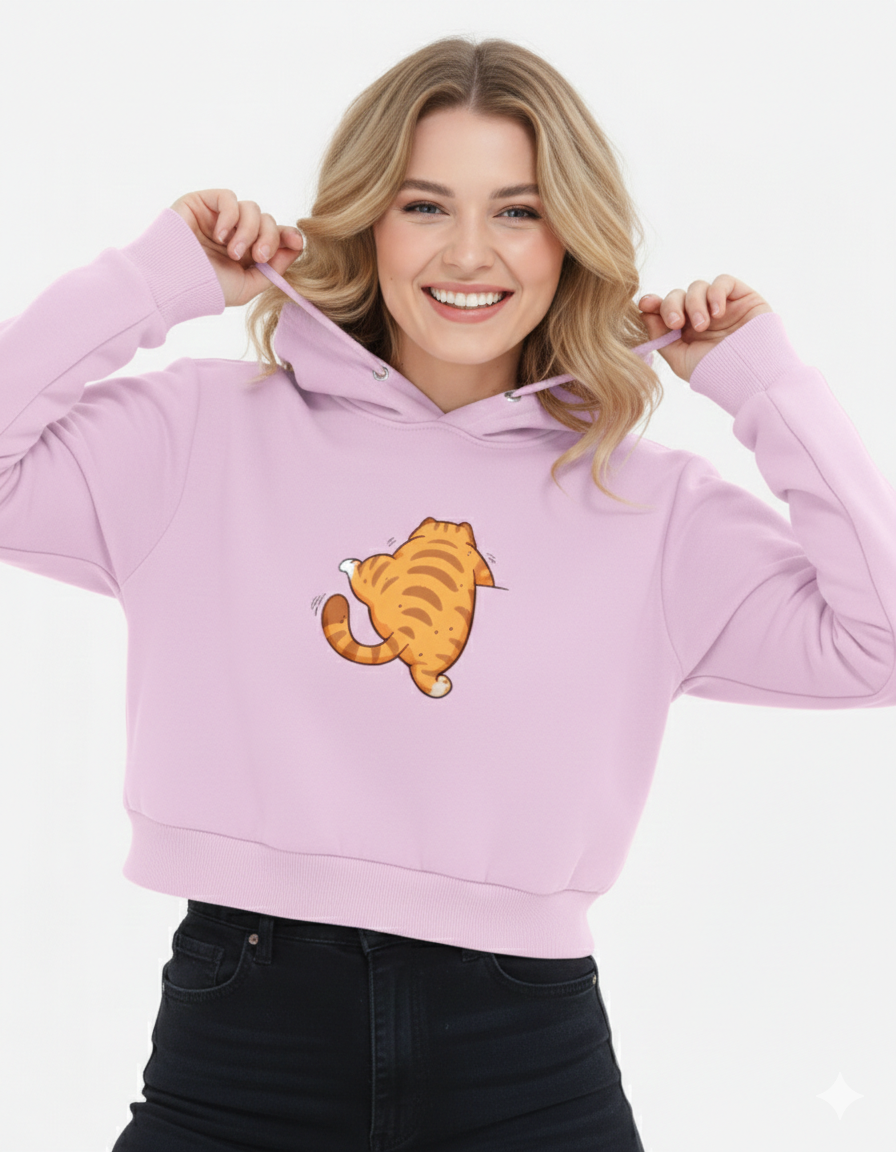 Woman wearing a light purple hoodie with a cartoon tiger design on a white background