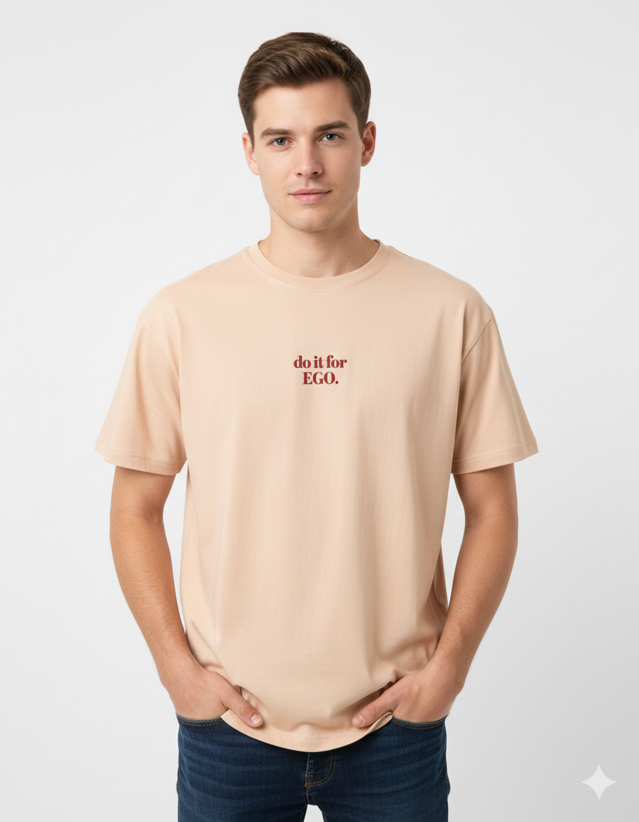 Man wearing a beige t-shirt with text on a white background