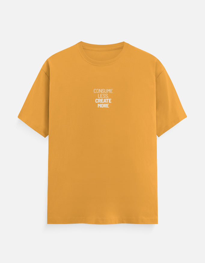 Mustard yellow t-shirt with white text on a light gray background