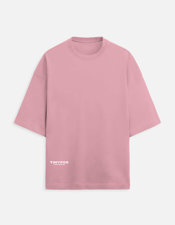 Pink oversized short-sleeve t-shirt with white TinyFox logo on front bottom left