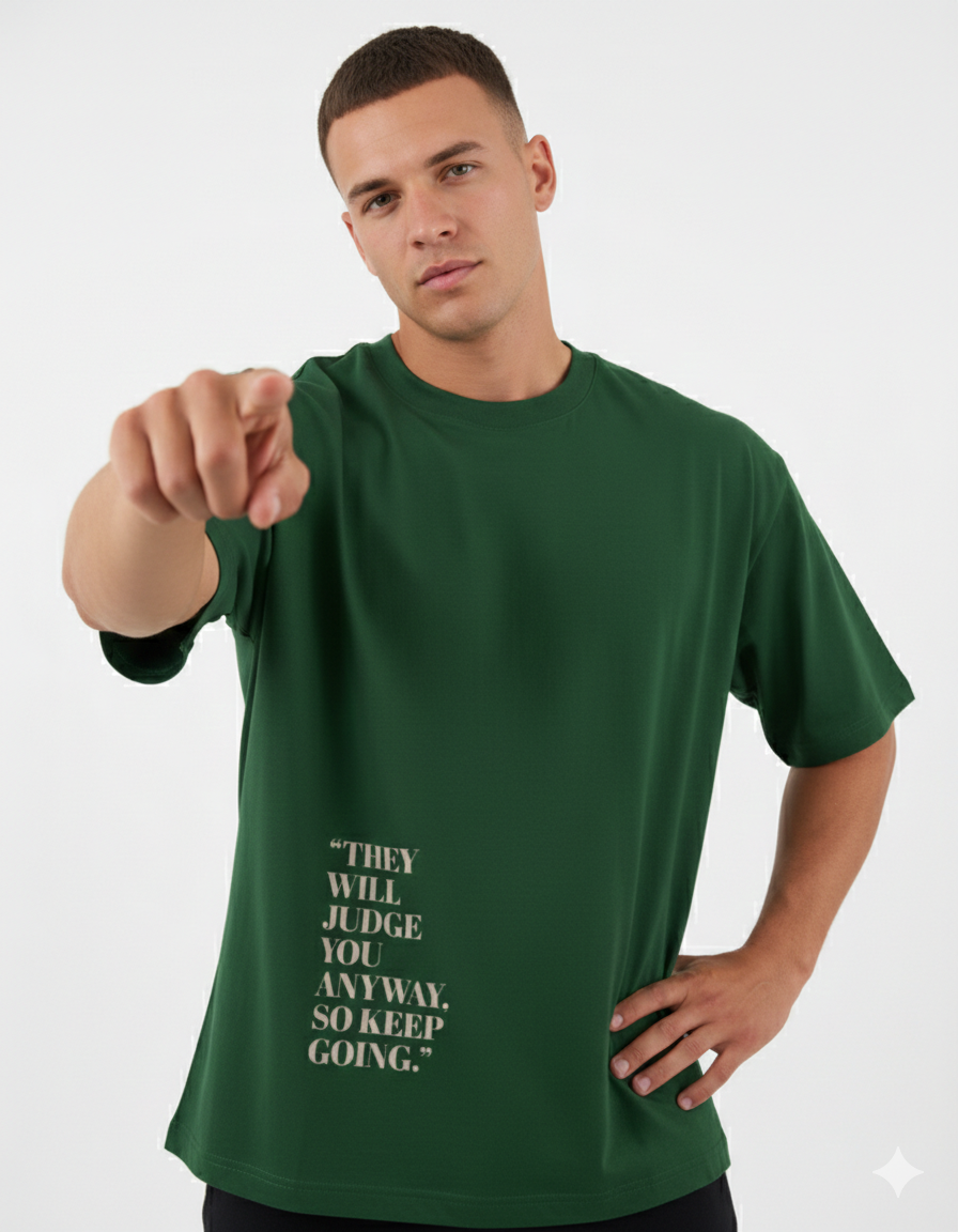 Man wearing a green t-shirt with motivational quote on a white background