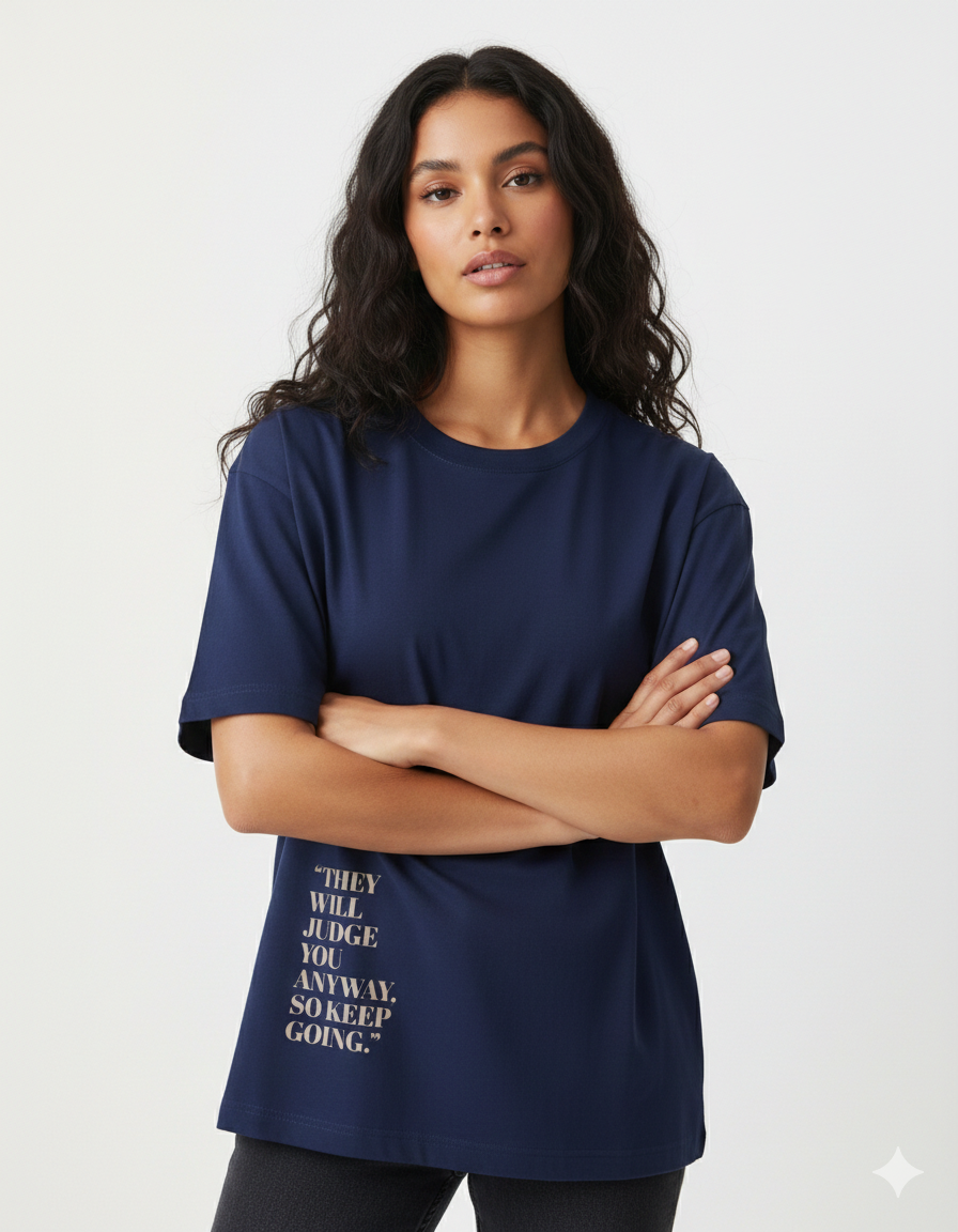 Woman wearing a navy blue t-shirt with text on a white background