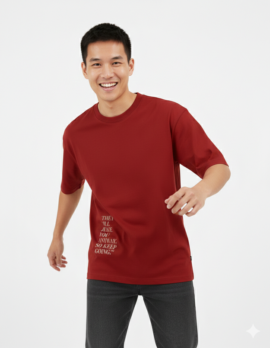 Man wearing a red t-shirt with text on a white background