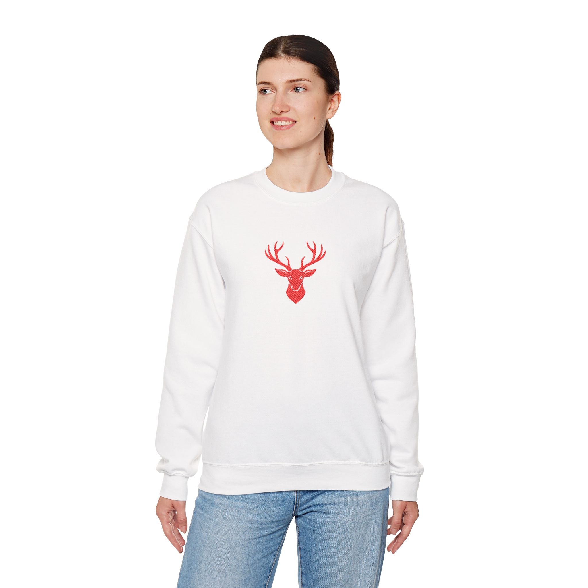 Woman wearing a white sweatshirt with a red deer design on a white background