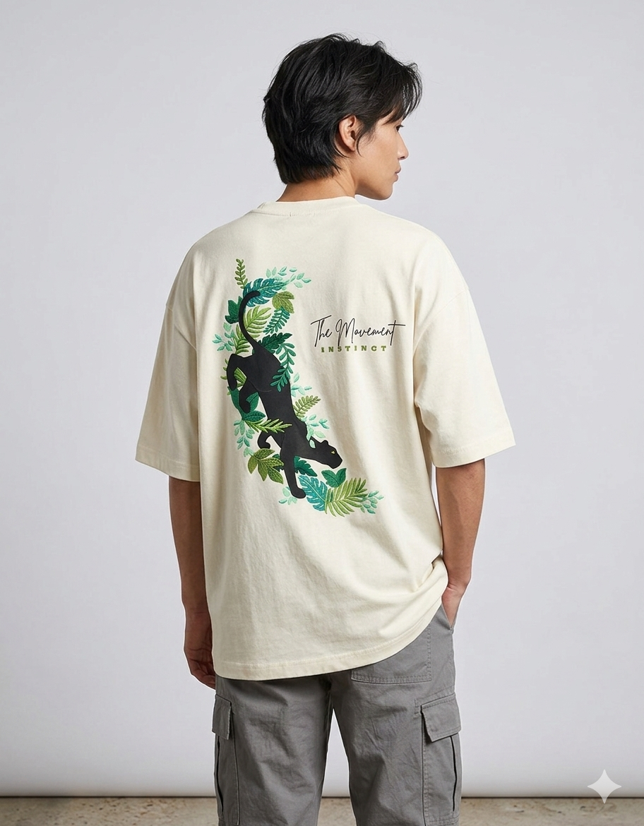 Man wearing cream T-shirt with panther and leaves graphic, cargo pants, casual fashion style
